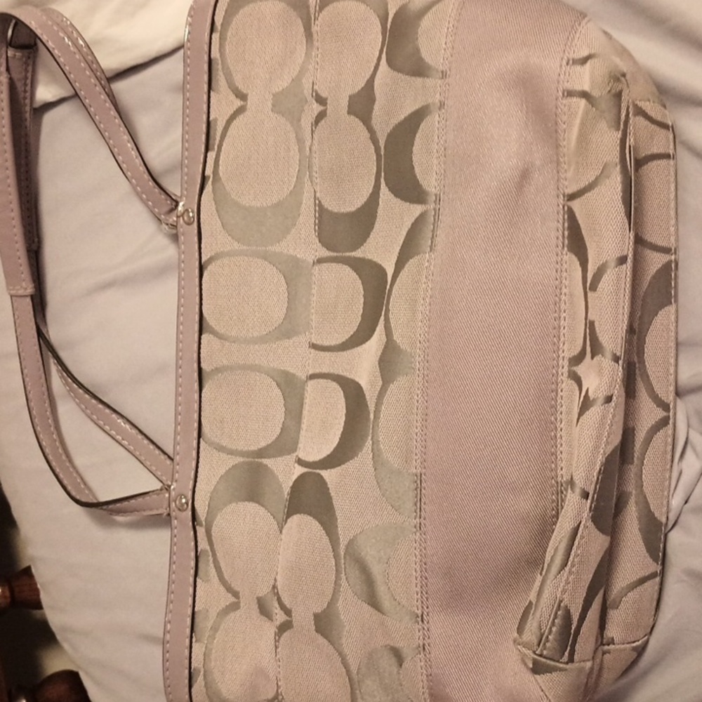 Coach purse and  matching cosmetic bag.